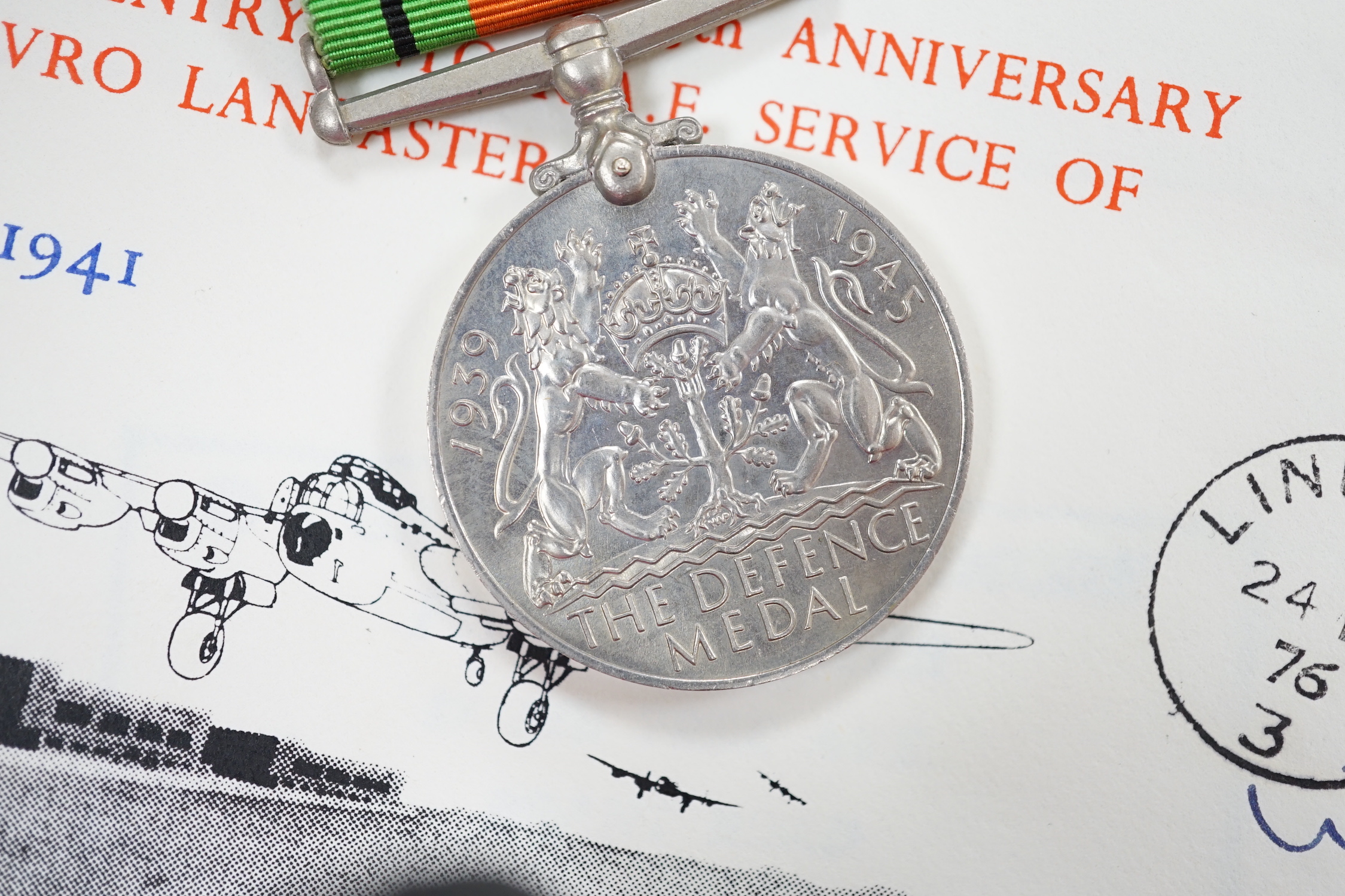 An RAF silver mug, and framed drawing of a map of Belgium and surrounding countries relating to 83rd Group Main HQ, Tactical Air Force 1944-45 together with four WWII medals in the original card, issue box; the Defence M